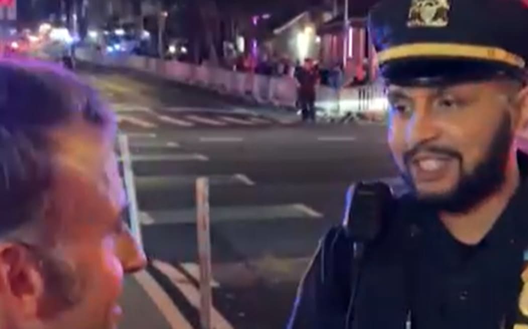French President Emmanuel Macron was stopped from crossing the street by a New York City police officer due to Trump's motorcade.