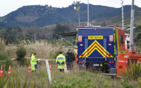 Forensics and police investigators examine the scene where John Murray Morton's body was found in Nelson Haven beside SH6 in Atawhai.