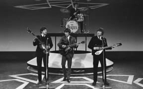 The Beatles performing in 1964