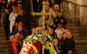 Members of the public pay their respects as they pass the coffin of Queen Elizabeth II as it lies in state inside Westminster Hall, at the Palace of Westminster in London on 15 September, 2022.