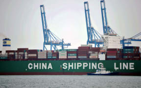 Cargo containers wait to be transported at a port in Qingdao