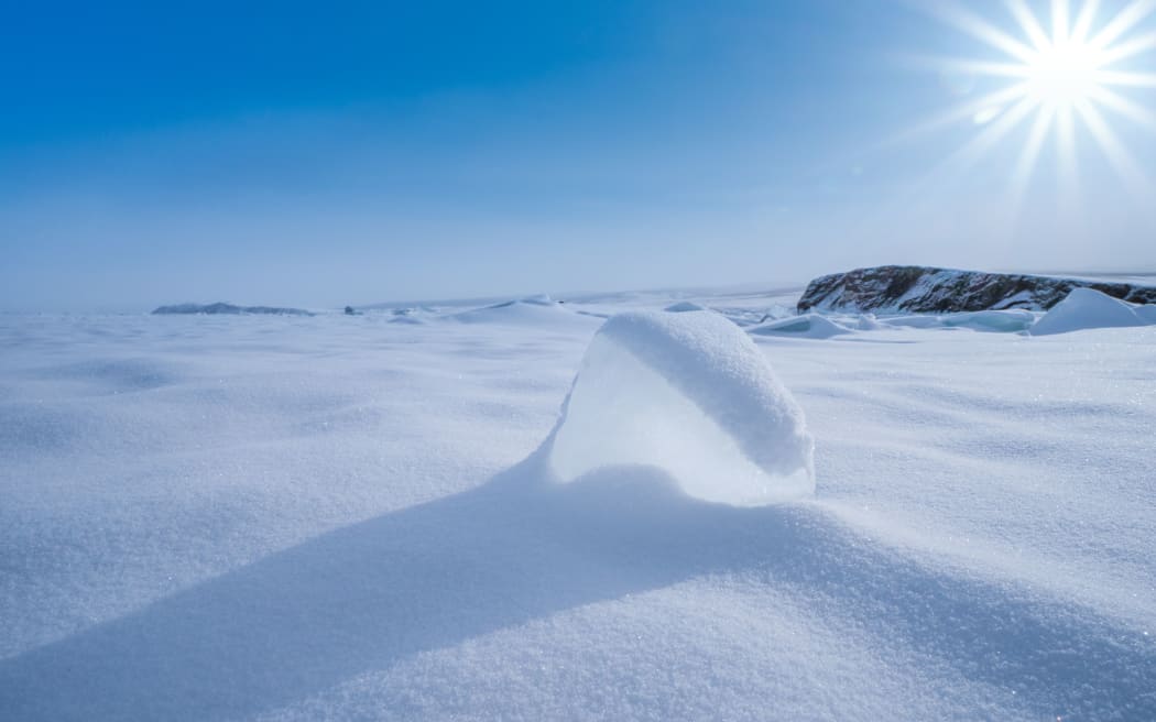 In this unlocated photo, a wonderful winter view around Lake Baikal, the largest freshwater lake by volume in the world, where pure ice and white snow are seen, southern Siberia, Russia.