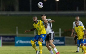 Fiji’s Leroy Jennings and Solomon Islands William Komasi during the FIFA World Cup 2026 - OFC Qualifiers, Round 2, Solomon Islands v Fiji. HFC Bank Stadium, Suva, Thursday 10 October 2024. Photo: Kirk Corrie / www.phototek.nz