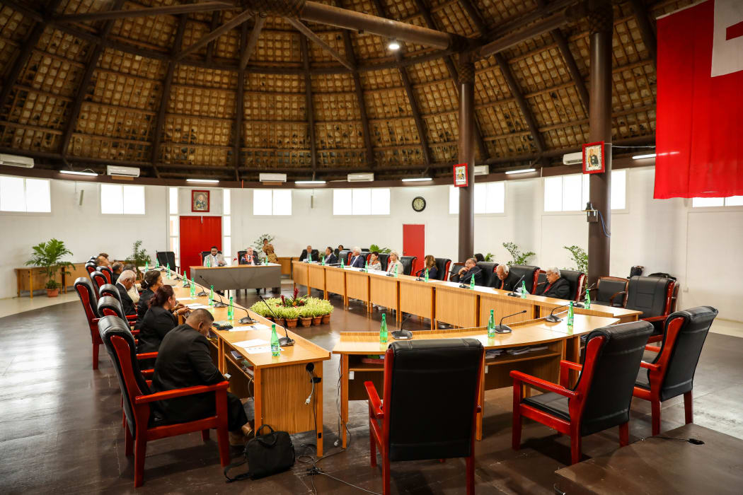 Half of the New Zealand delegation talk public engagement with some Tonga MPs at the temporary Legislative Assembly site.