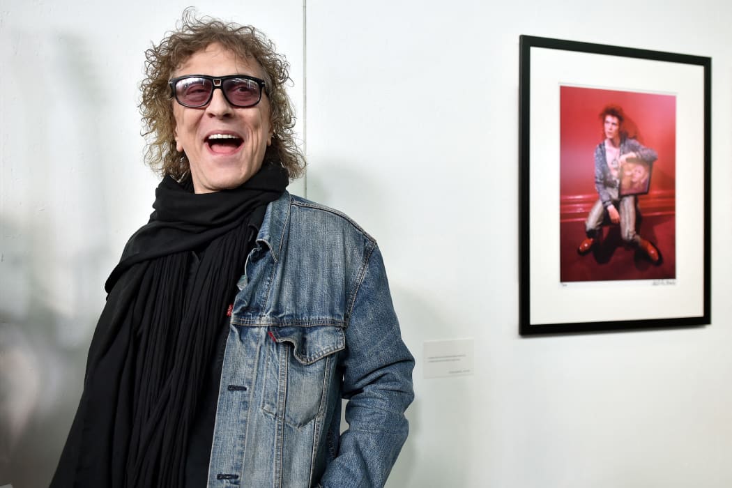 British photographer Mick Rock poses for a photograph during his 2016 exhibition "Life on Mars", on David Bowie's Ziggy Stardust years, at the "Le Multiple" exhibition hall in Toulouse.