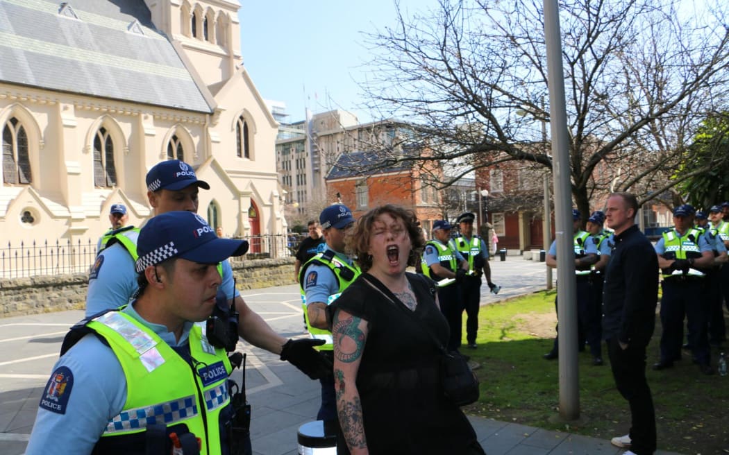 Police at a protest rally at St Patrick's Square in Auckland after the person accused of dousing Posie Parker with tomato sauce applied to have their charges dismissed.
