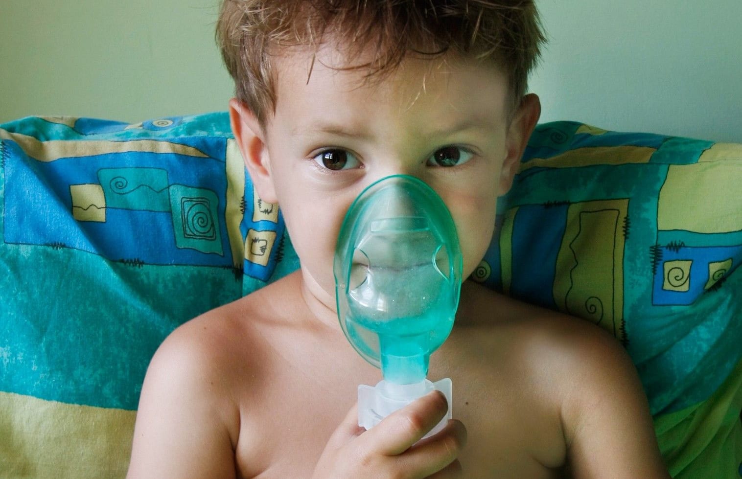 A child with asthma using a nebuliser inhaler for breathing problems (file photo).