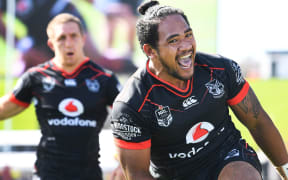 Ryan Hoffman looks on as Solomone Kata scores a try.