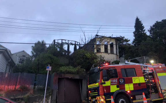 A fire truck outside a house on Hanson St, Newtown, gutted by fire.