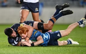 Blues halfback Finlay Christie scores against the Brumbies right on halftime