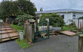Debris and a destroyed fence after a suspected tornado in Waikanae on 9.6.2022.