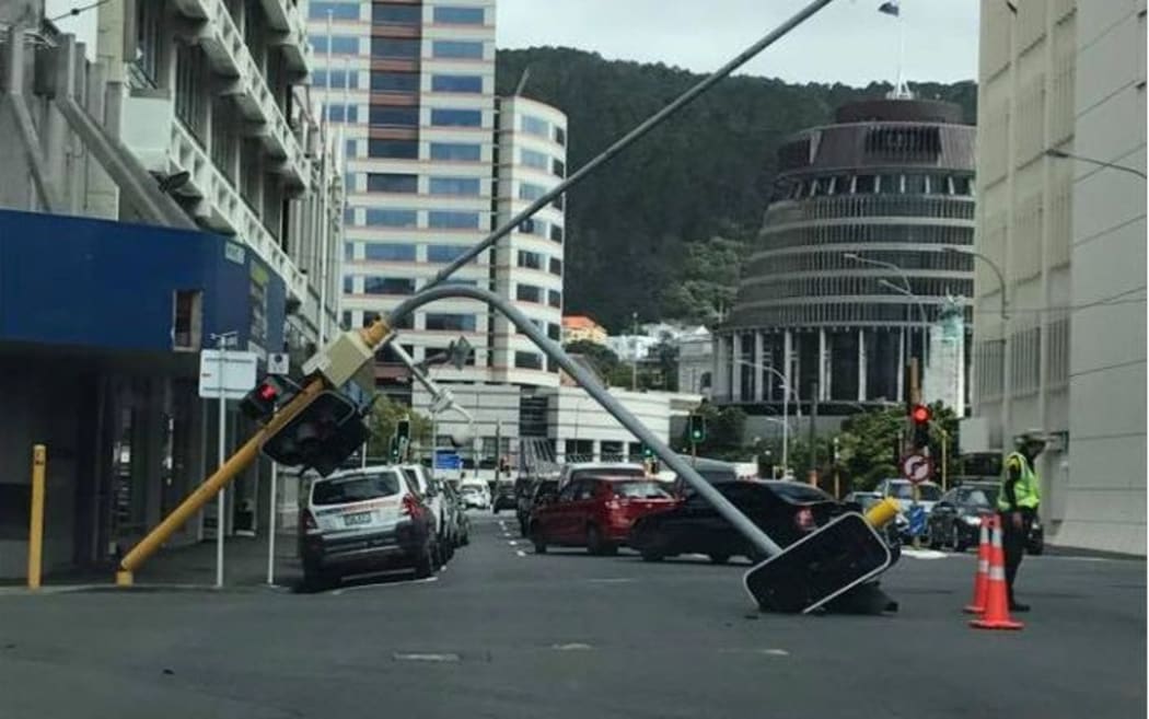 Traffic lights at a Wellington intersection have toppled onto the road.
