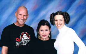 New Zealand Star Wars fans Matt ad Kristy Glasgow with Carrie Fisher in 2011.
