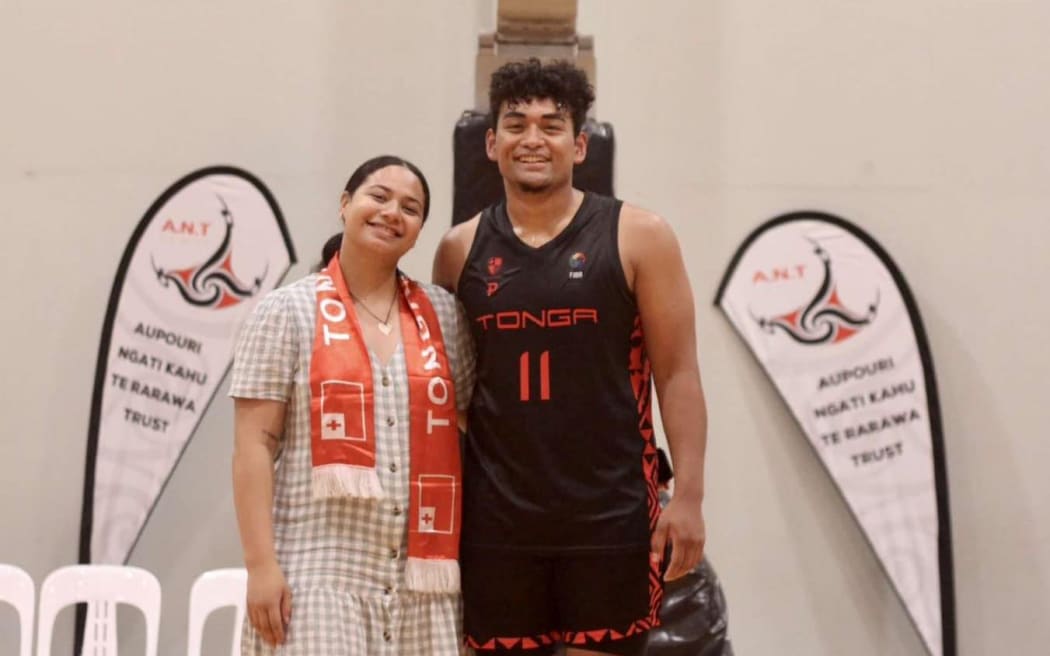 Stephen Paea poses in Basketball jersey.