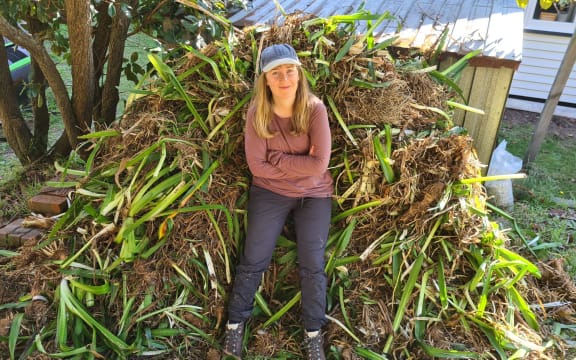 Holly Neill with agapanthus she dug up from her garden