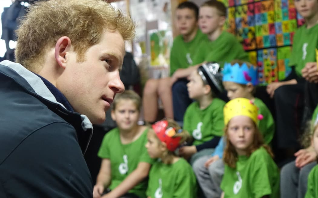 Prince Harry with children at Halfmoon Bay School.