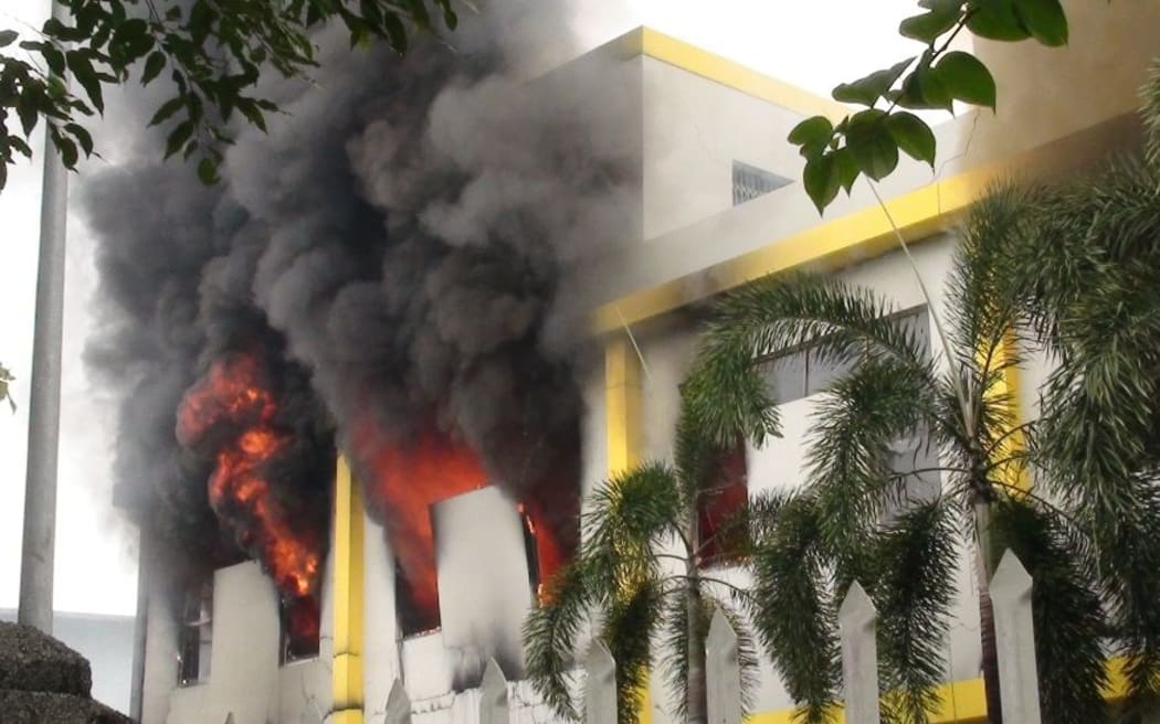 Smoke and flames billow from a factory window in Binh Duong, Vietnam.