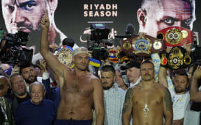 Britain's Tyson Fury, left, and Ukraine's Oleksandr Usyk.
