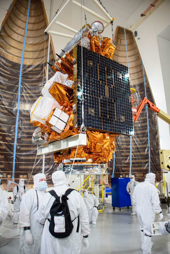 Technicians prepare the US National Oceanic and Atmospheric Administration’s (NOAA) Joint Polar Satellite System-2 (JPSS-2) for a low-earth orbit flight test at Vandenberg Space Force Base (VSFB) in California on October 5, 2022.