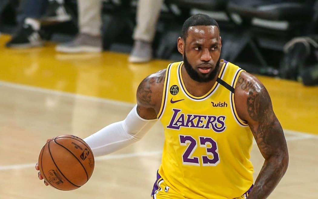 LeBron the brightest star among stars at Lakers home debut