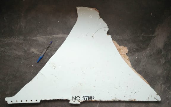 One of the pieces of debris found in Mozambique thought to be from MH370. It reads 'no step'.
