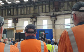 Workers listen as Regional Development Minister Shane Jones  announces nearly $$20m from the Provincial Growth Fund for upgrades.to Dunedin's Hillside workshop.