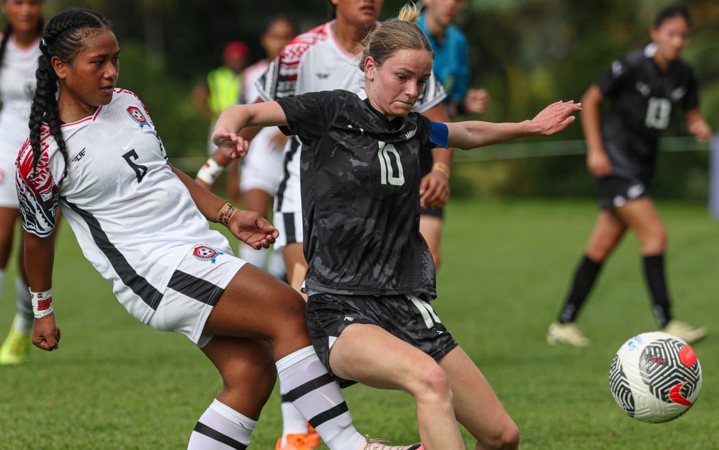 New Zealand's Ameila Hitchcock competes with Tonga's Sophie Hale. OFC U-16 Women's Championship 2025, New Zealand v Tonga.
