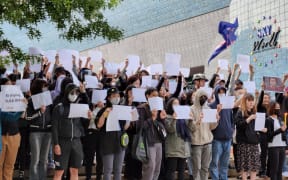 Protestors held white A4 paper as a symbol of defiance against censorship by the Chinese government.