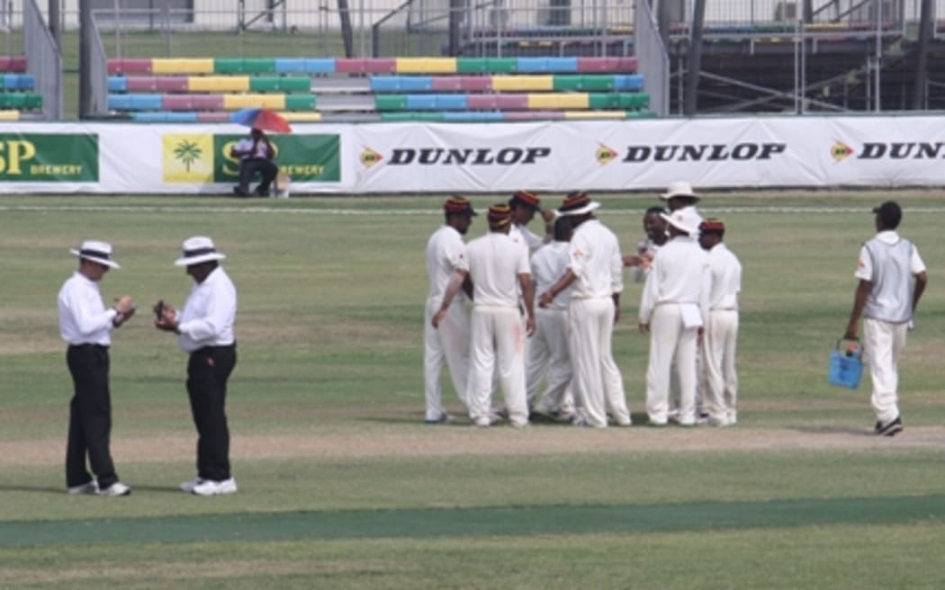 PNG celebrate a rare success in the field on day three.