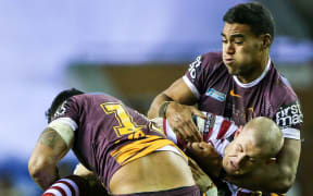 Joe Ofahengaue showing some strong defence for the Broncos.