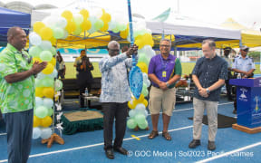 Solomon Islands Prime Minister Manasseh Sogavare with the Pacific Games baton