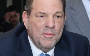 (FILES) Harvey Weinstein arrives at the Manhattan Criminal Court, on February 24, 2020, in New York City. New York's highest court on April 25, 2024, overturned Hollywood producer Weinstein's 2020 conviction on sex crime charges and ordered a new trial. In their decision, judges cited errors in the way the trial had been conducted, including admitting the testimony of women who were not part of the charges against him. "Order reversed and a new trial ordered," the judges wrote. (Photo by Angela Weiss / AFP)