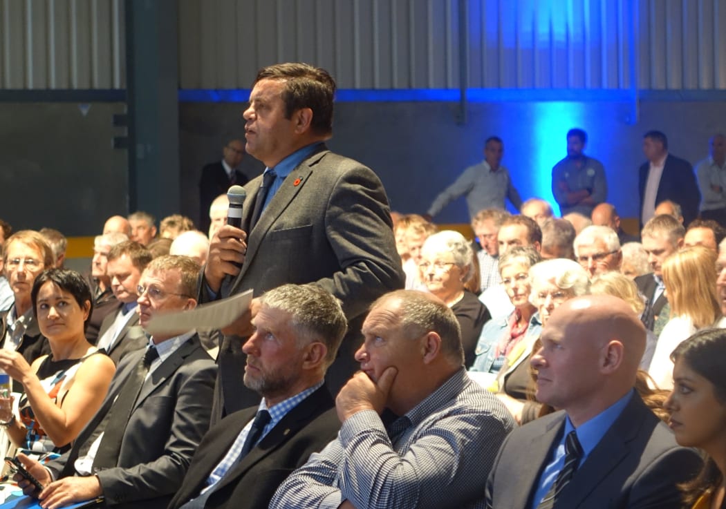 Shareholders ask questions of the board.