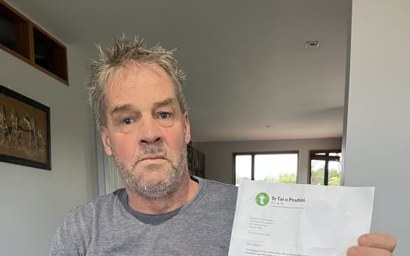 Kumara resident Russell Spaan with the TTPP letter which has come as a shock.