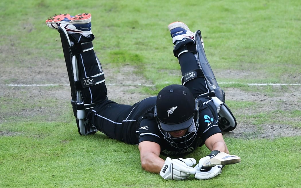 Ross Taylor dives for his crease.