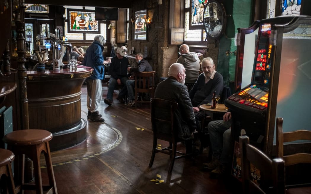 Clients visiting Lismore pub in Glasgow.  PM Nicola Strugeon announced on the same day new circuit breaker restrictions affecting pubs and restaurants to counter COVID-19 pandemic for two weeks starting Friday night.
