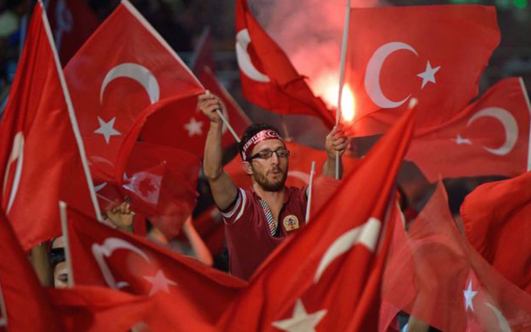 Turkish flags are waved in support of the Turkish president in Taksim Square in 2016.