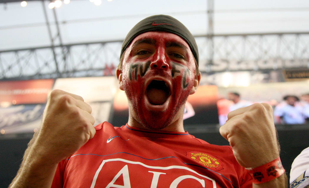 A Manchester United fan celebrates during the game of the MLS All-Stars against Manchester United FC in the 2010 MLS All-Star game in Houston, Texas.