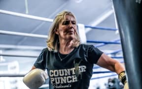 Johanna Quirk is using a boxing bag at a Counterpunch class in Auckland.