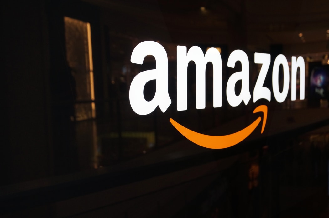 Amazon logo on black shiny wall in San Francisco mall custom crop