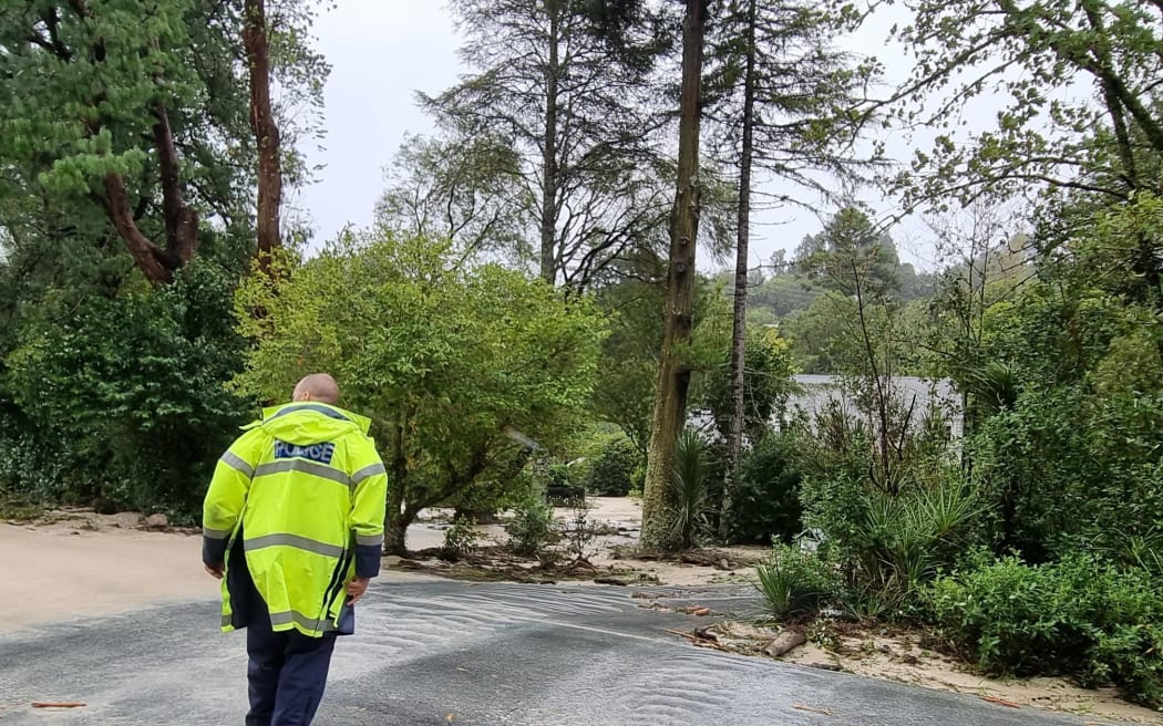 Police at a flooded property on Whareora Road in Whangārei during Cyclone Gabrielle. 14/2/23