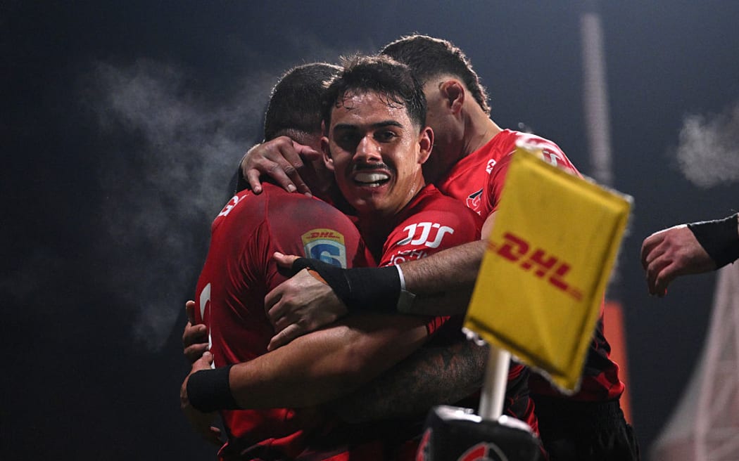 Codie Taylor of the Crusaders celebrates after scoring a try with Noah Hotham of the Crusaders during the Super Rugby Pacific Grand Final match between Crusaders and Chiefs at Apollo Projects Stadium.
