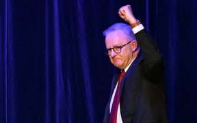 Anthony Albanese arrives onstage after winning the general election.