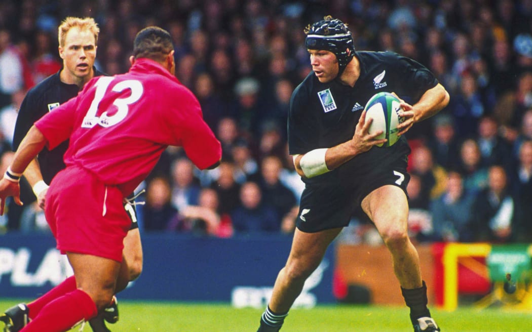 All Blacks flanker Josh Kronfeld in action during the pool match between the All Blacks and Tonga at the 1999 Rugby World Cup. Photo: Sport the Library/PHOTOSPORT


v vs RWC 99