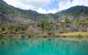 A lake in the pit of the long defunct Panguna mine in Bougainville.