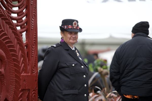 A Māori warden overseeing one of the gates into Tuurangawaewae Marae during the tangihanga of Kiingi Tuheitia on 2 September 2024.