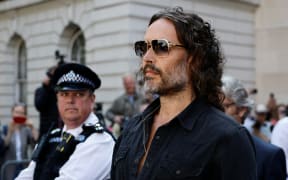 British actor and comedian Russell Brand departs Westminster Magistrates Court in London on May 2, 2025. British comedian and actor Russell Brand was on Friday bailed by a London court after he appeared to face five charges of rape and other sexual offences. (Photo by BENJAMIN CREMEL / AFP)