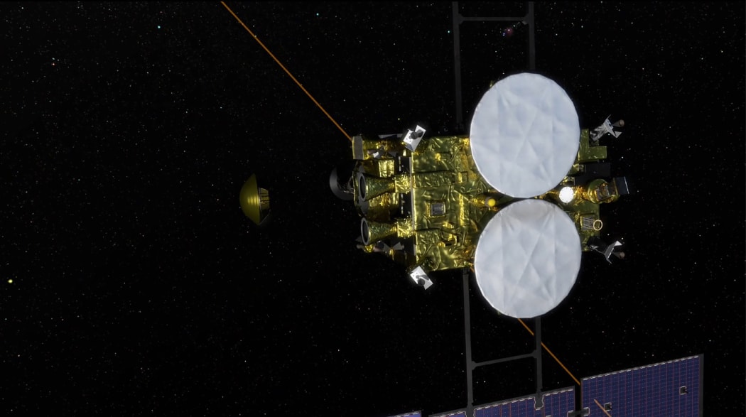 An artist's rendering of the separation of a capsule from the space probe Hayabusa-2, containing a sample collected from the asteroid Ryugu.