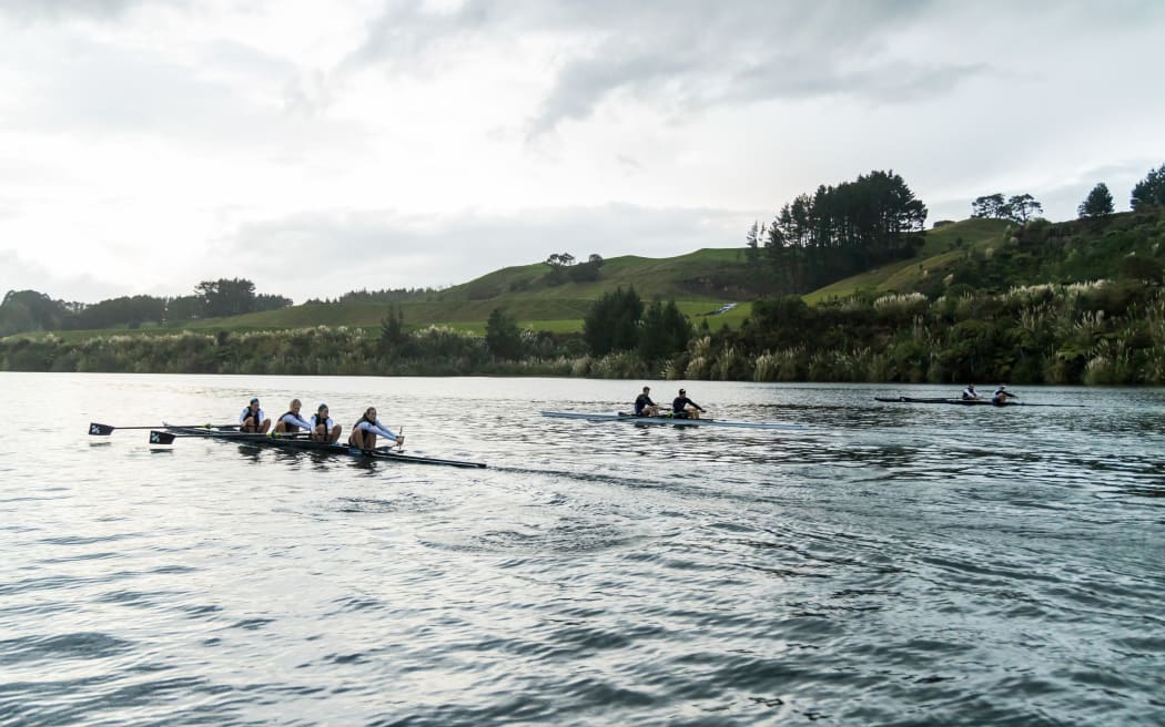 New Zealand elite rowers training on Lake Karapiro.