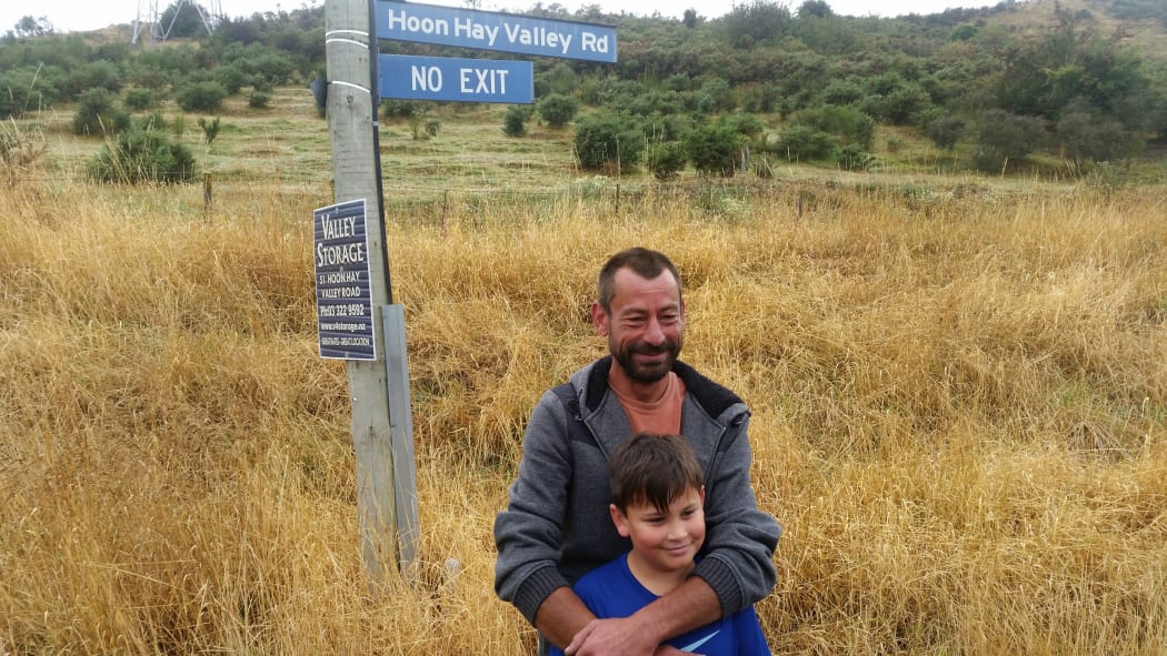 Hoon Hay valley road resident Cory Beynon with his son Levi.
